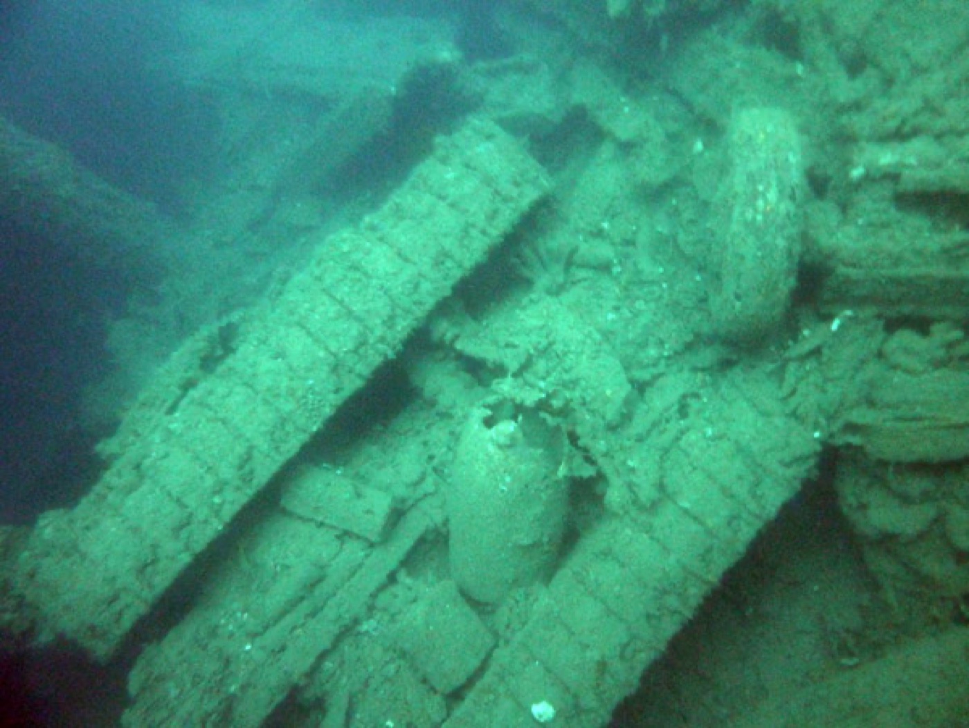 Coral-crusted cargo in the hold