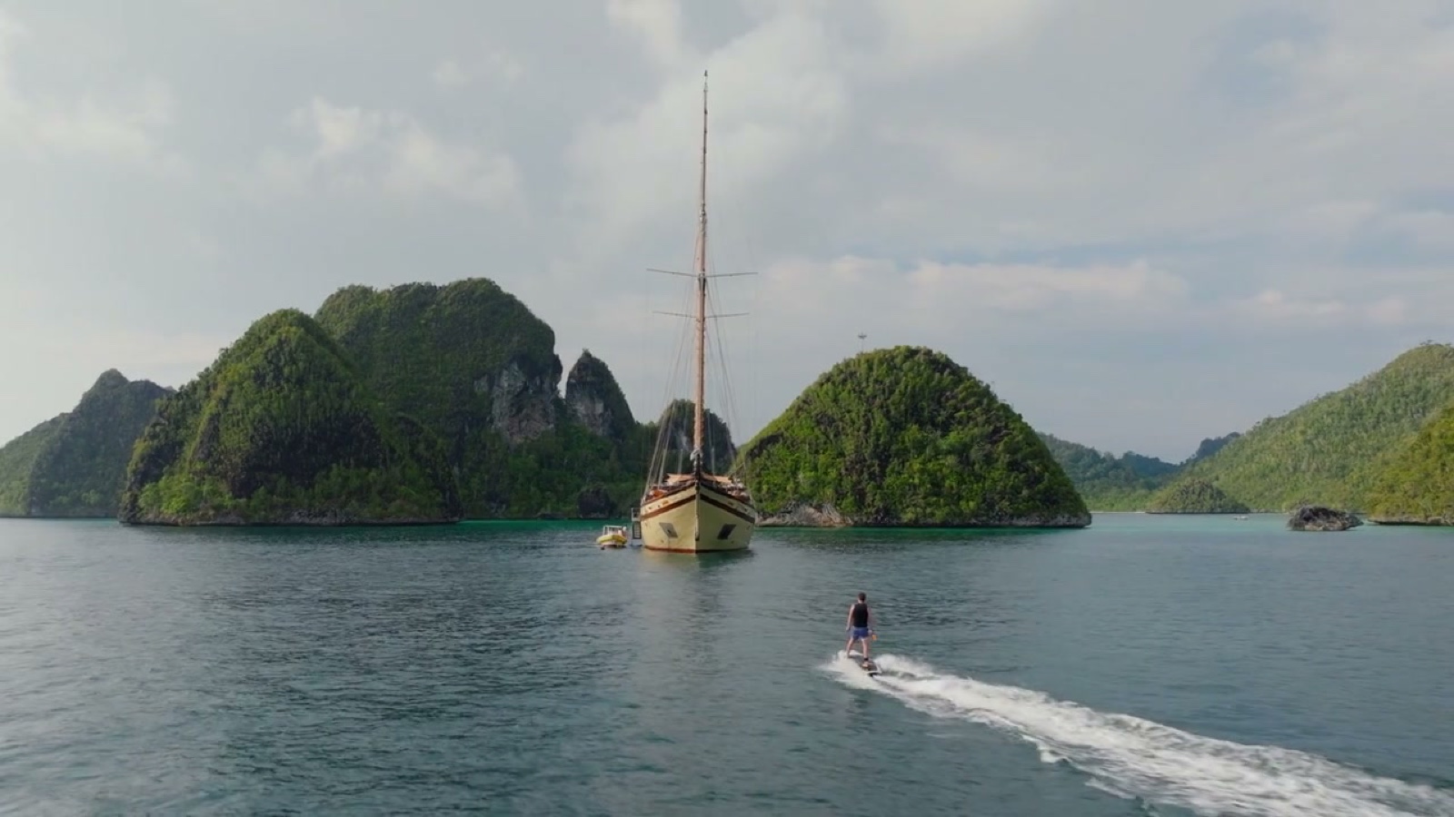 Sailing yacht between karst islands, Raja Ampat